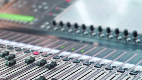 Audio mixer in a studio, the automatic knobs moving up. ready for the recording Stock Footage 76907840