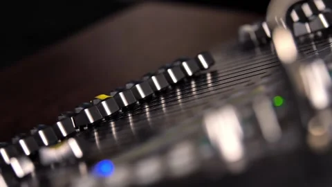 Audio mixer in studio, automatic knobs moving up and down on console Stock Footage 222967369
