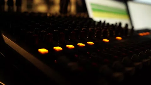 Audio mixer in studio with yellow buttons in work process in high resolution Stock Footage