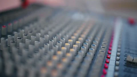 Audio mixing board with a colorful button knobs, technology background 스톡 동영상 274310149