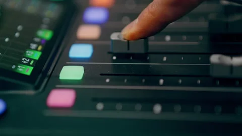 Audio Mixing Console Fader Adjusted by Finger in Studio, Close Up Stock Footage 336743950