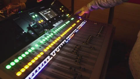 Audio mixing console, sound engineer working, balance of sound, soundboard knobs Stock Footage 114716649