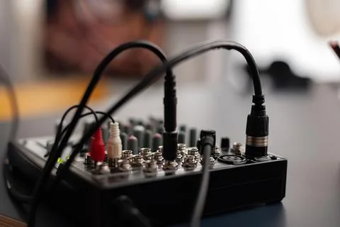 Audio module with connected cables on black panel Stock Photos