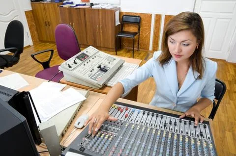 Audio operator at audio control console Stock Photos