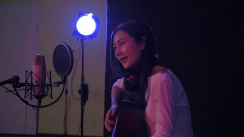 Audio recording concept of 4k Resolution. Soloist girls singing in the studio Stock Footage 144622386