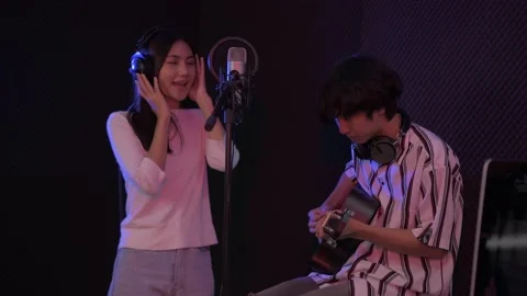 Audio recording concept of 4k Resolution. Artists are creating their music in Stock Footage 144622397