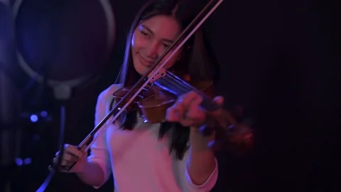 Audio recording concept of 4k Resolution. Asian girls playing violin in the s Stock Footage 144622473