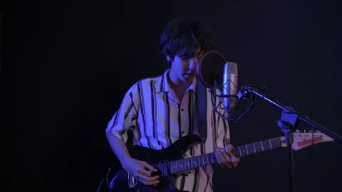 Audio recording concept of 4k Resolution. The musicians are playing the guita Stock Footage 145321571