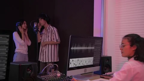 Audio recording concept of 4k Resolution. Asian male and female couple singin Stock Footage 146491881