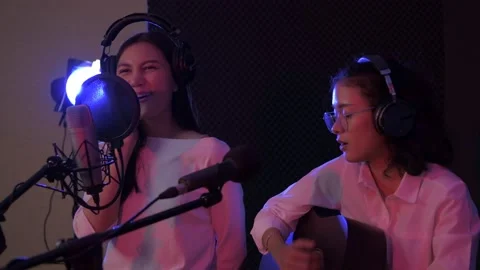 Audio recording concept of 4k Resolution. Young artist duo singing in the stu Stock Footage 146491905