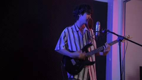 Audio recording concept of 4k Resolution. The musicians are playing the guita Stock Footage 154690435