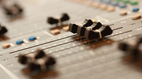 Audio recording professional adjusts large mixing board in recording studio Stock Footage 39956090