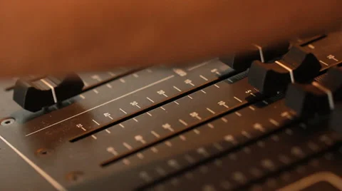 Audio recording professional adjusts large mixing board in recording studio 8 Stock Footage 39959214