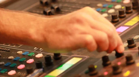 Audio recording professional adjusts large mixing board in recording studio 10 Stock Footage 39959567