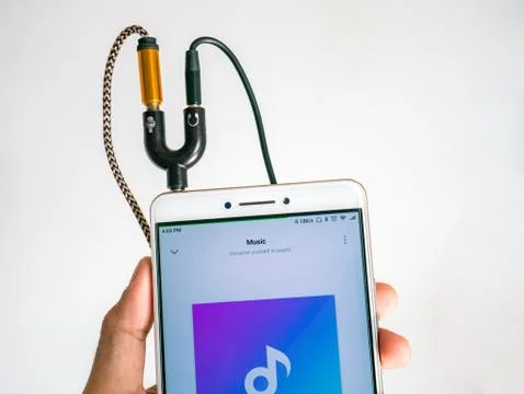 Audio Splitter 3.5mm Inserted to Smartphone For Microphone and Headphone Stock Photos