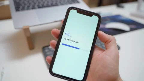 Audio transcription progress bar stops at 70 percent on smartphone screen Stock Footage 342603131