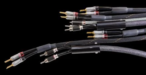 Audio video by cables on a black background. Stock Photos