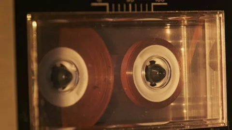 Vintage reel-to-reel tape recorder with spinning reels was made in