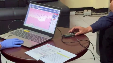 Audiometry hearing test using laptop and device in clinic setting. Stock Footage 336364427