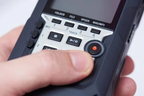Audiorecorder in hand close up Stock Photos