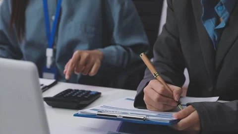 Auditor and accountant working in office Analyze financial data and account.. Stock Footage 335862486