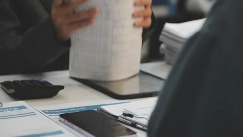 Auditor and accountant working in office Analyze financial data and account.. Stock Footage 335862546
