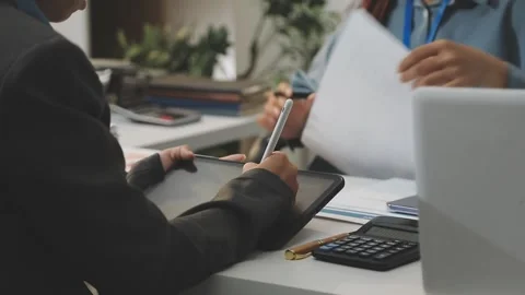 Auditor and accountant working in office Analyze financial data and account.. Stock Footage 335862577