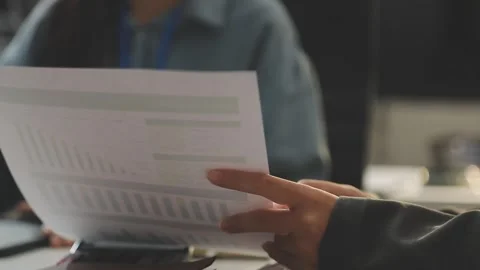 Auditor and accountant working in office Analyze financial data and account.. Stock Footage 335863187