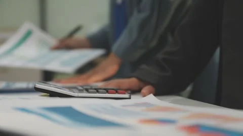Auditor and accountant working in office Analyze financial data and account.. Stock Footage 335863494