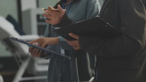 Auditor and accountant working in office Analyze financial data and account.. Stock Footage 335863767
