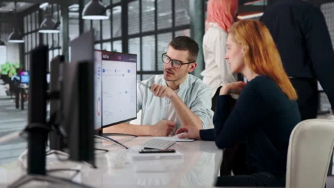 Auditor Carefully Reviews Activity Logs On Multiple Screens Stock Footage 333396505