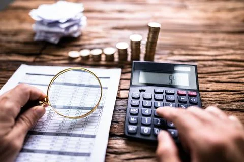 Auditor Hand Checking Invoice Using Magnifying Grass Stock Photos