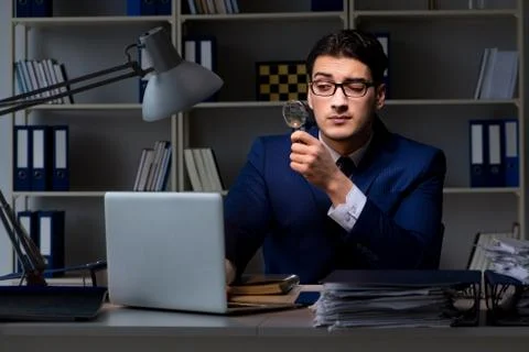 Auditor looking for errors in financial reporting for company 写真素材