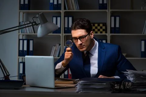 Auditor looking for errors in financial reporting for company 스톡 사진
