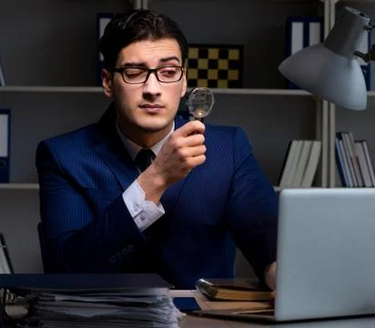 The auditor looking for errors in financial reporting for compan 스톡 사진