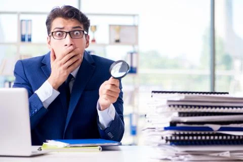 Auditor looking for errors in the financial statements 스톡 사진