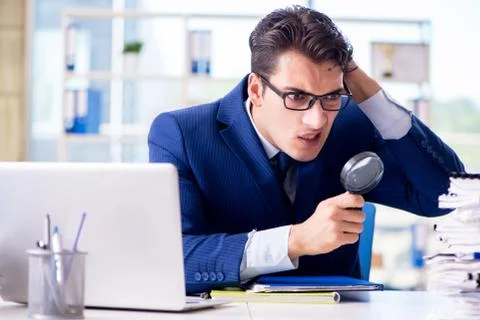 Auditor looking for errors in the financial statements 스톡 사진