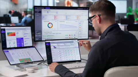 Auditor Reviews Compliance Dashboard On Touchscreen Laptop Stock Footage 340397425