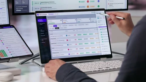 Auditor Reviews Compliance Dashboard On Touchscreen Laptop Stock Footage 342963359