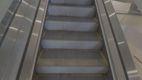 AUG 10.2026.MALAYSIA.Going up the escalator inside the shopping mall Video stock 341849092