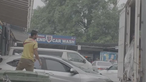 AUG 16.2026.MALAYSIA.Workers are loading the goods onto the truck. Stock Footage 344011177