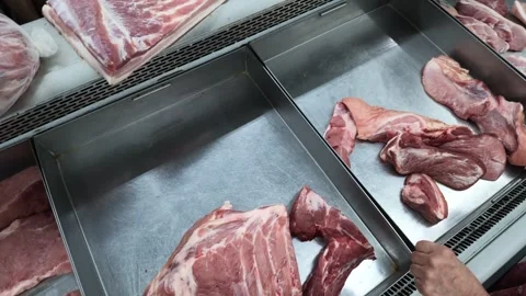 AUG 2.2026.MALAYSIA.A close-up of raw pork in a meat market display case. Video stock 341401445