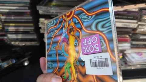 AUG 2.2026.Malaysia.A person is browsing through various music CDs in a shop. Vidéo 341401598