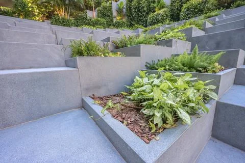 Aug 3 2024 seamless background featuring isometric square pyramids garden Stock Photos