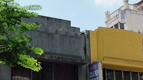 AUG 4.2026.MALAYSIA.A close-up shot of a yellow storefront. Video stock 341552453