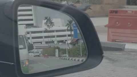 AUG 6.2026.MALAYSIA.A close-up of a vehicle's side-view mirror. Video stock 341802167