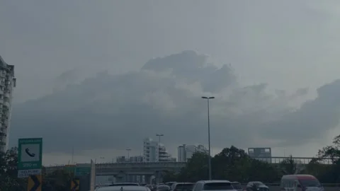 AUG 6.2026.MALAYSIA.Dark clouds gathered over the highway interchange. Video stock 341839221