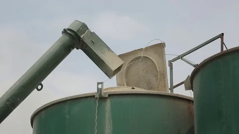The auger-grain chaser bin empties, the grain at the Elevator Stock Footage 73938645
