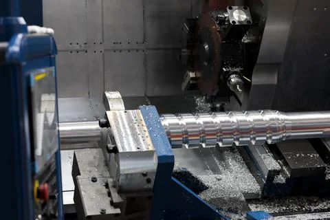 Auger manufacturing process on a CNC machine Stock Photos