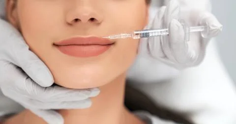Augmentation and improvement lips in professional salon. Stock Photos